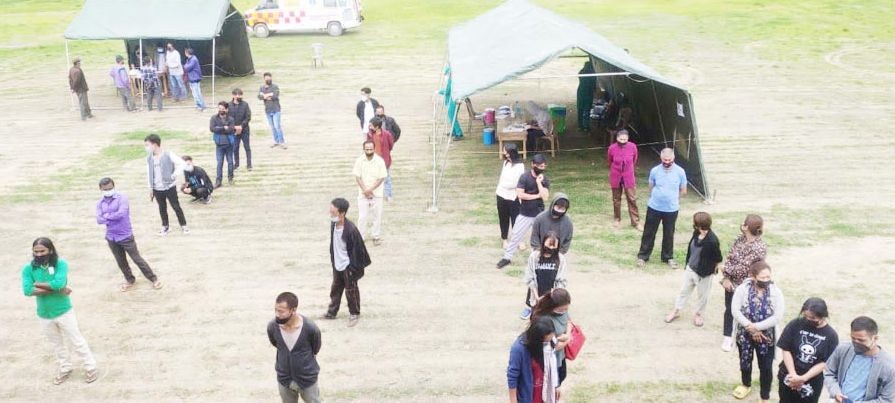 Beneficiaries wait in queue to avail special vaccination drive organized for high risk groups at Pfutsero Town Sports Complex from July 2 to 4. (DIPR Photo)